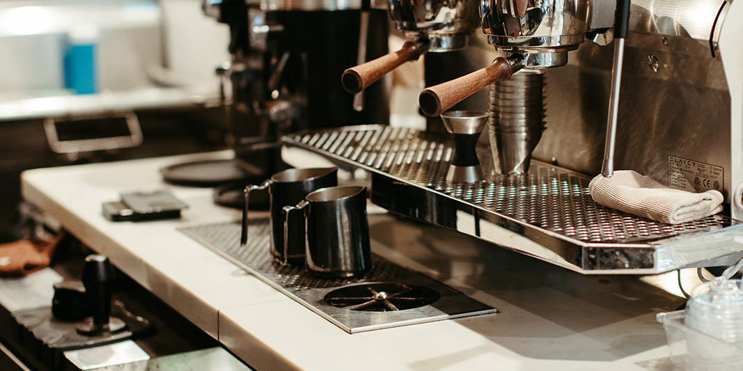 photograph of espresso machine and coffee bar at cherry coffee shop