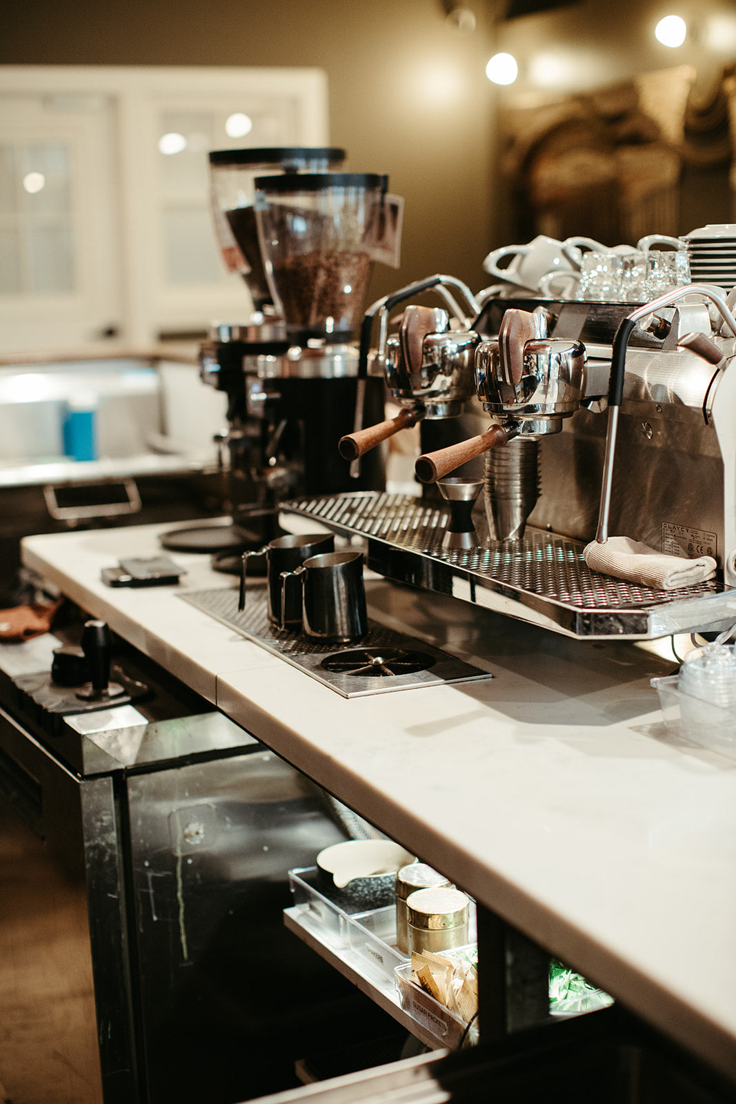 photograph of espresso machine and coffee bar at cherry coffee shop