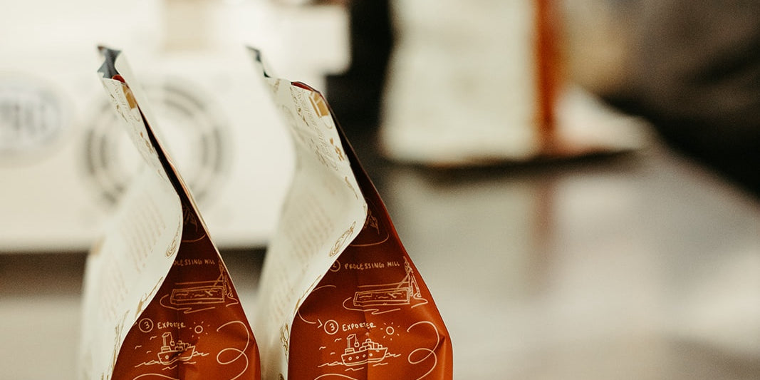photograph of two cherry coffee bags turned to the side in the production space